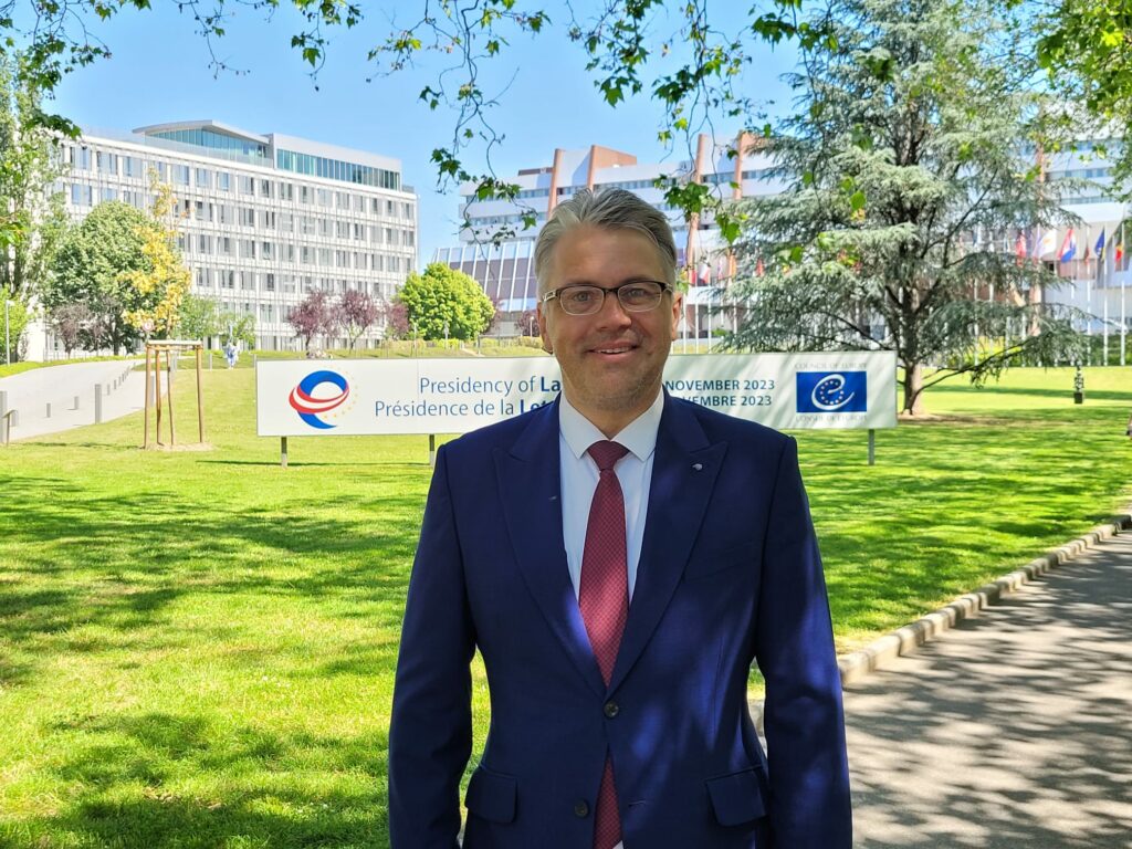 Ombudsman Juris Jansons in front of the Council of Europe building in Strasburg, France